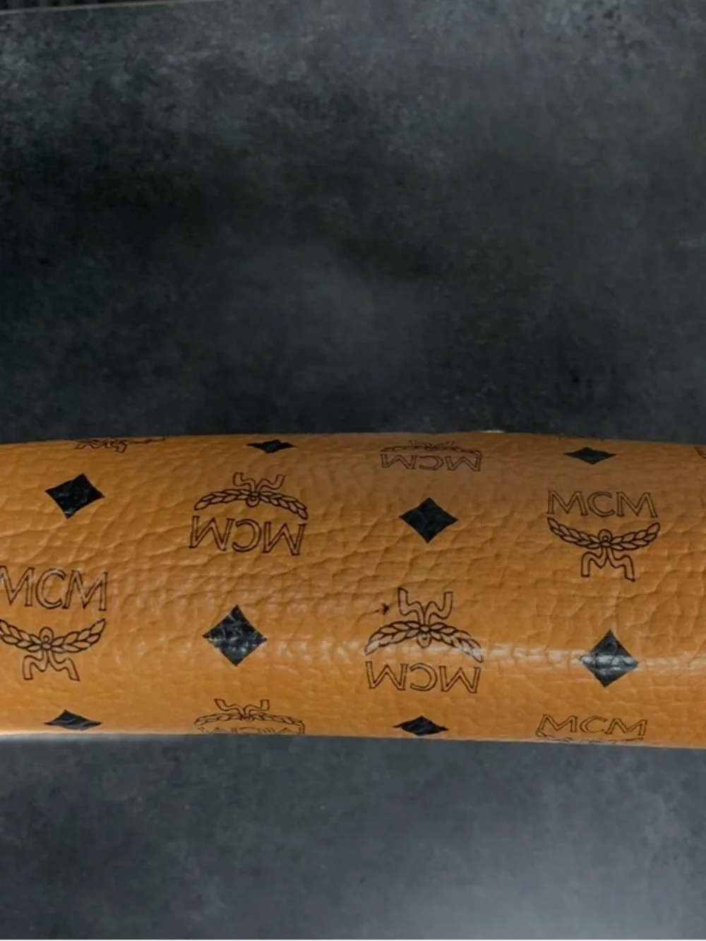 MCM Cognac and Black Visetos Monogram Pouch with Gold Plaque.